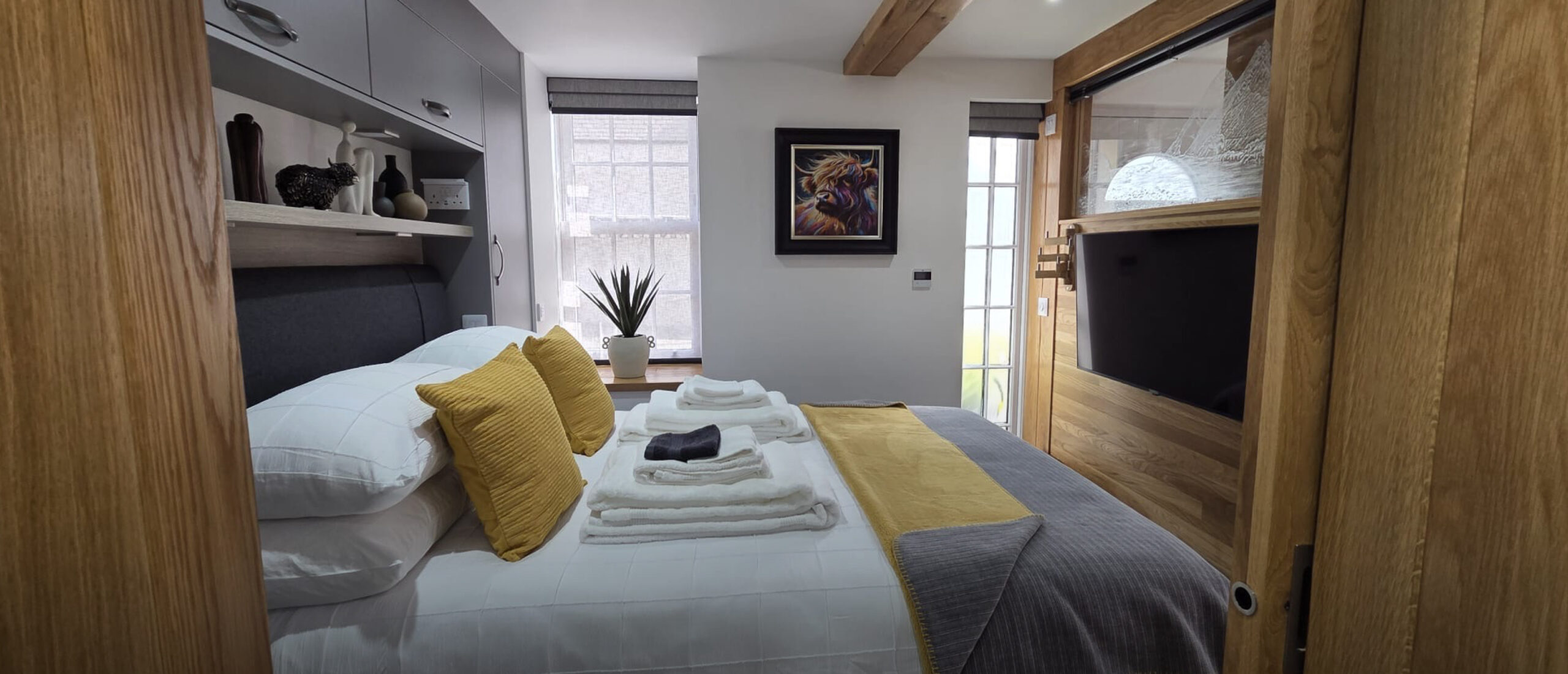 Bedroom with double bed and coastal details